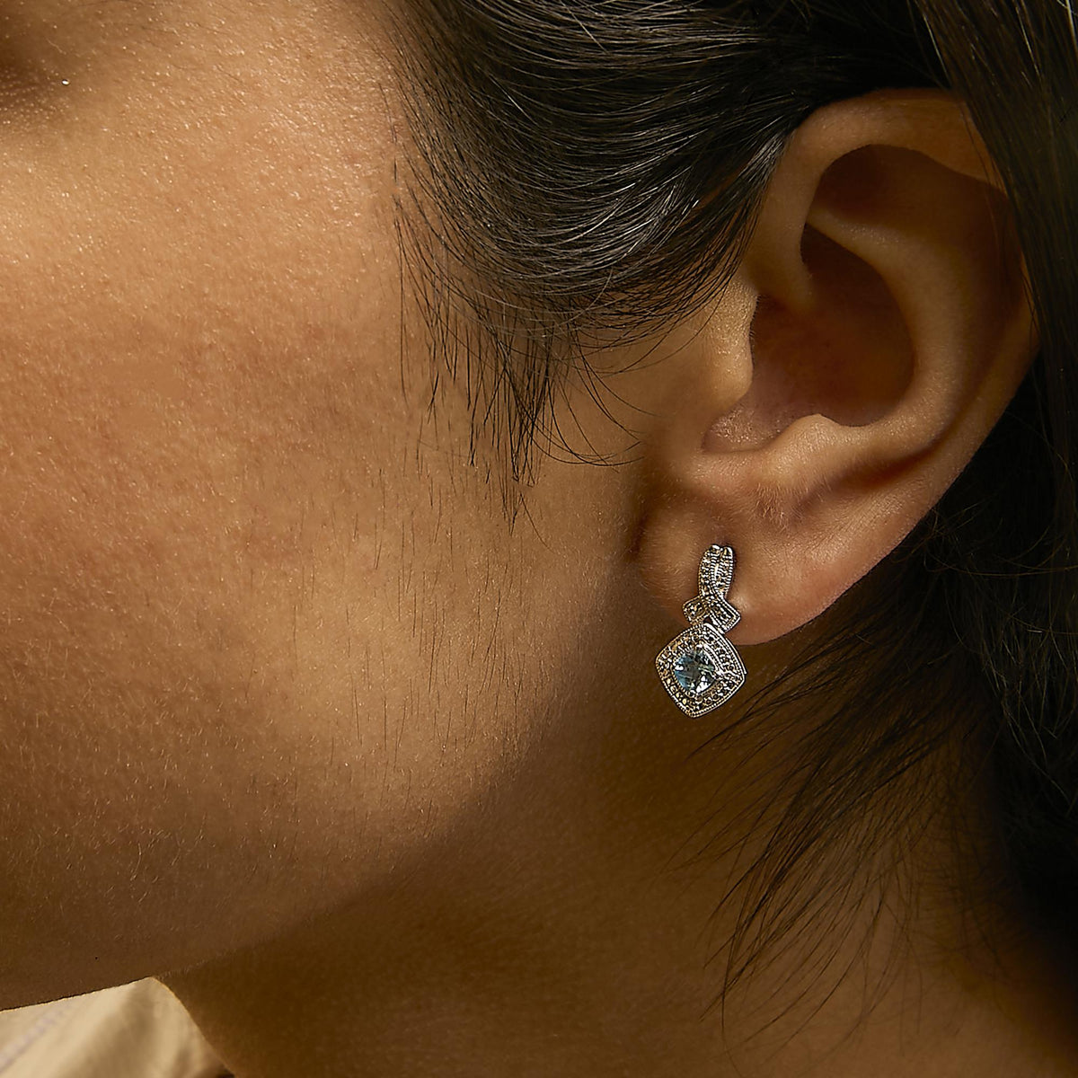 Sterling Silver Cushion Cut Blue Topaz and Diamond Accent Twist Motif Dangle Earrings